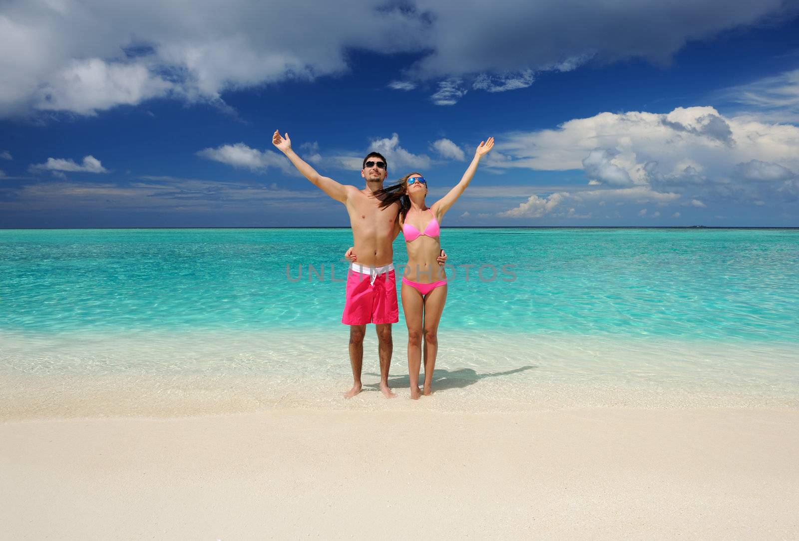 Couple on a tropical beach at Maldives