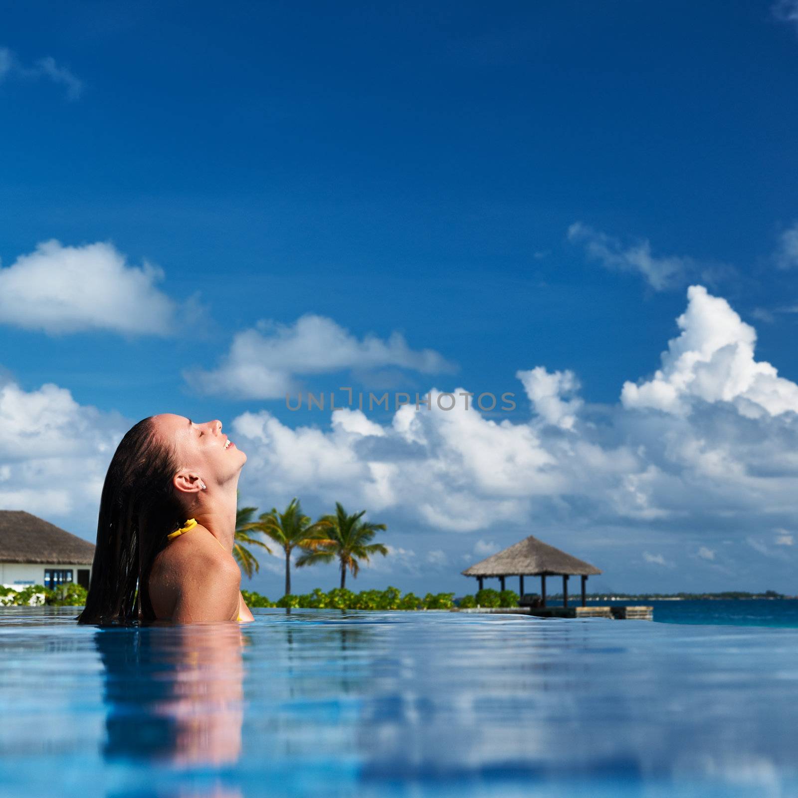 Woman at poolside by haveseen