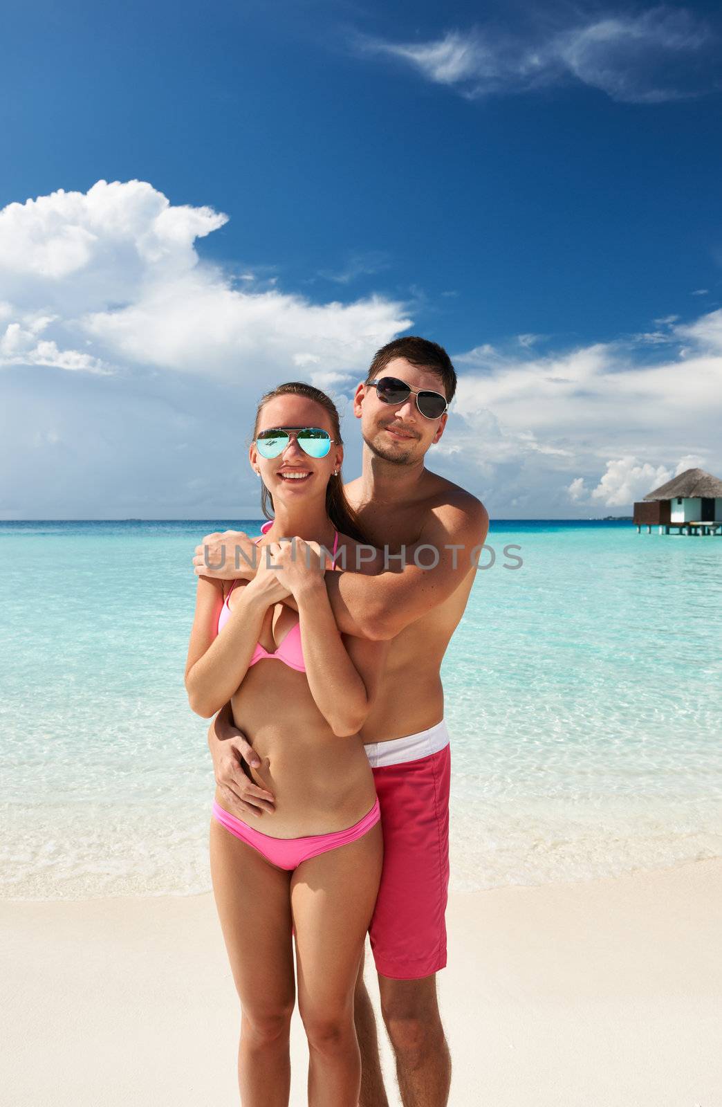 Couple on a beach at Maldives by haveseen