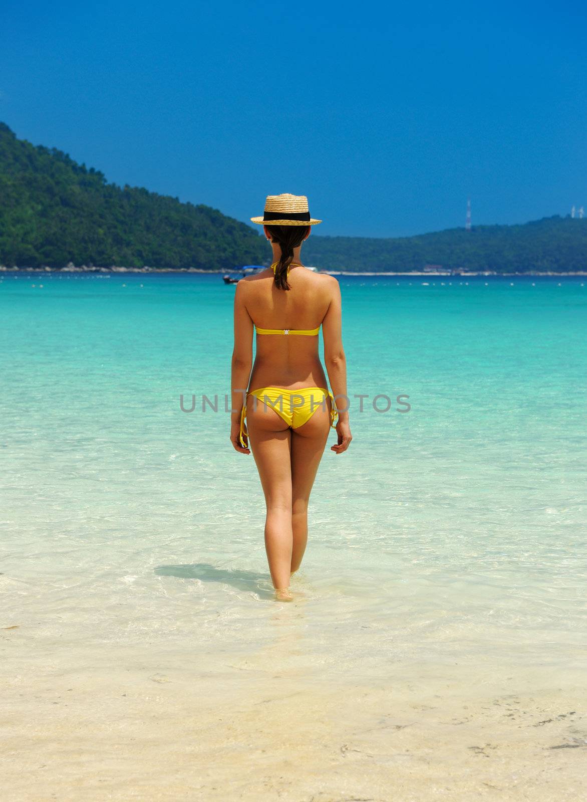 Woman in hat at beach