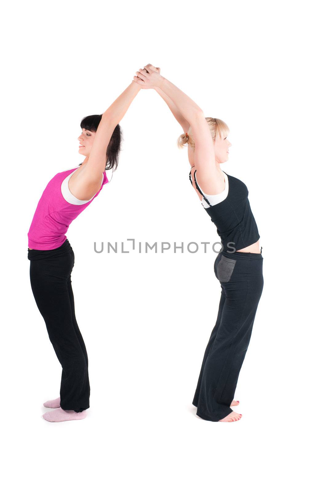 Shoot of two fitness instructors doing exercises isolated on white