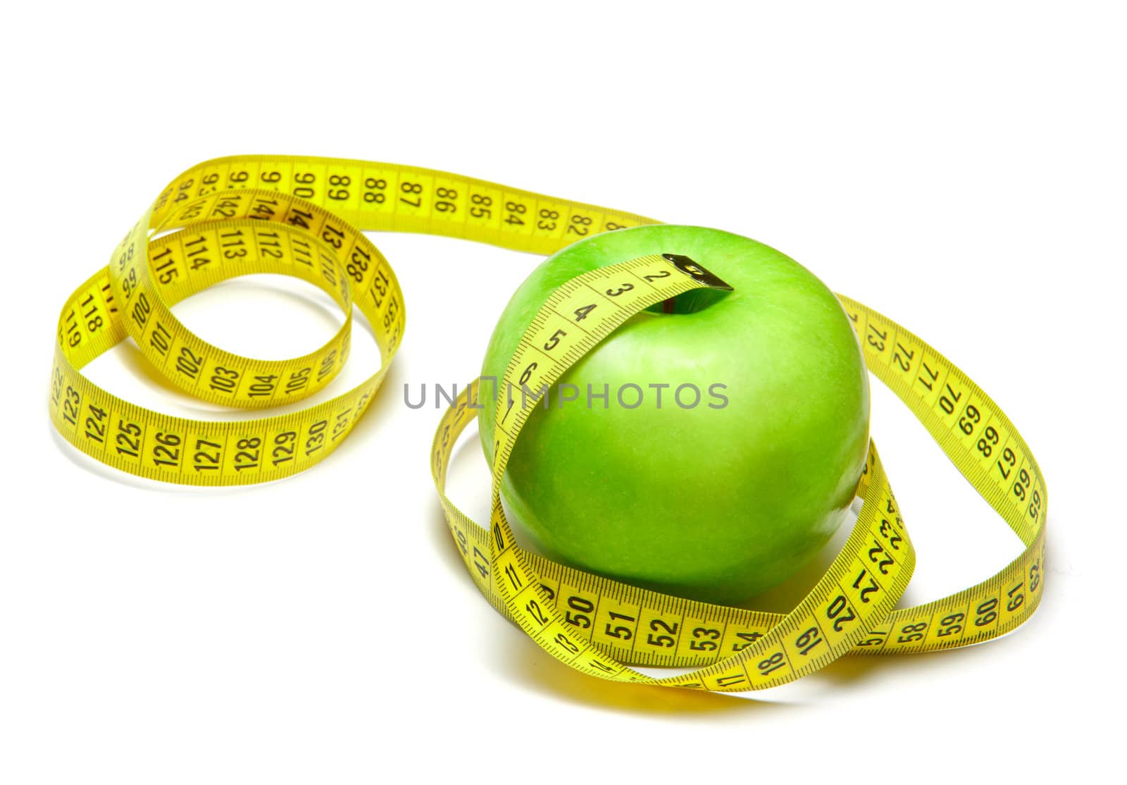 Green apple with centimeter tape