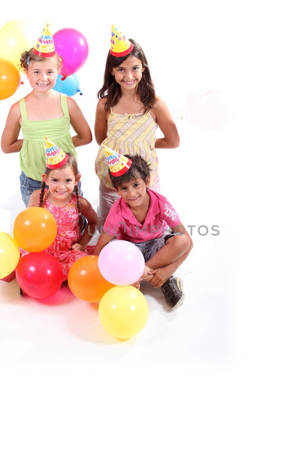 four kids at a party by phovoir