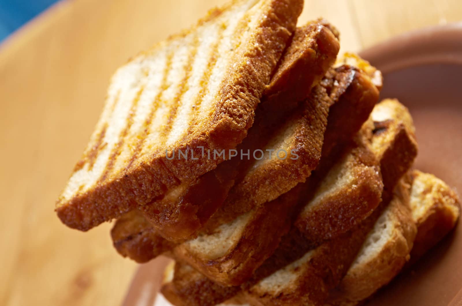 pile  toasted bread slices for breakfast.Close up of toasted white bread in slices