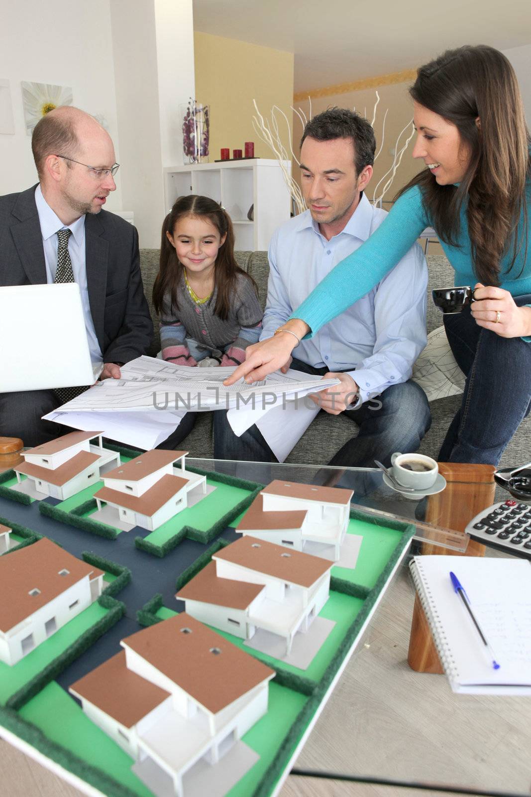 Young family sitting in an architect's office