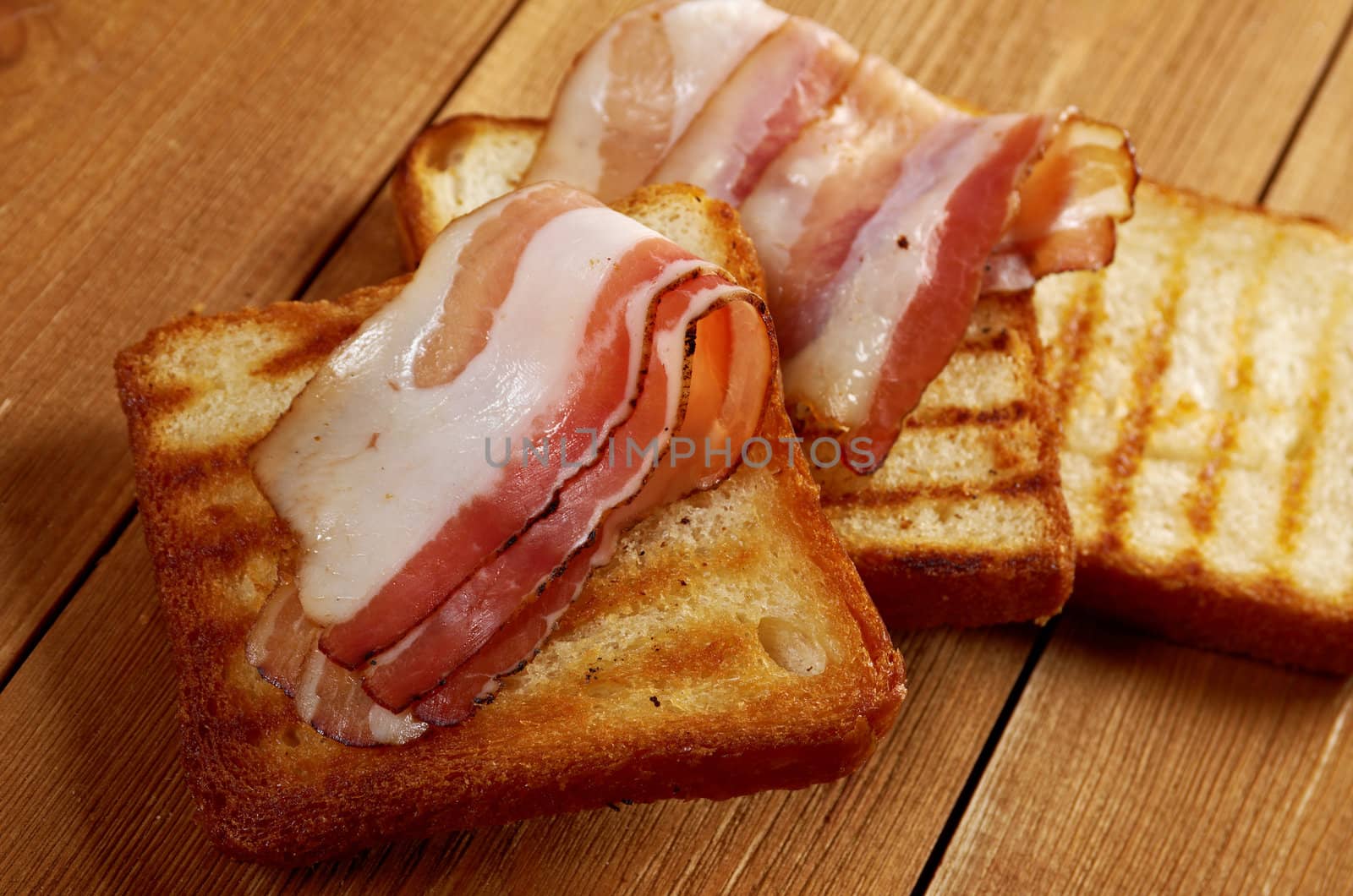 pile  toasted bread slices for bacon.Close up of toasted white bread in slices