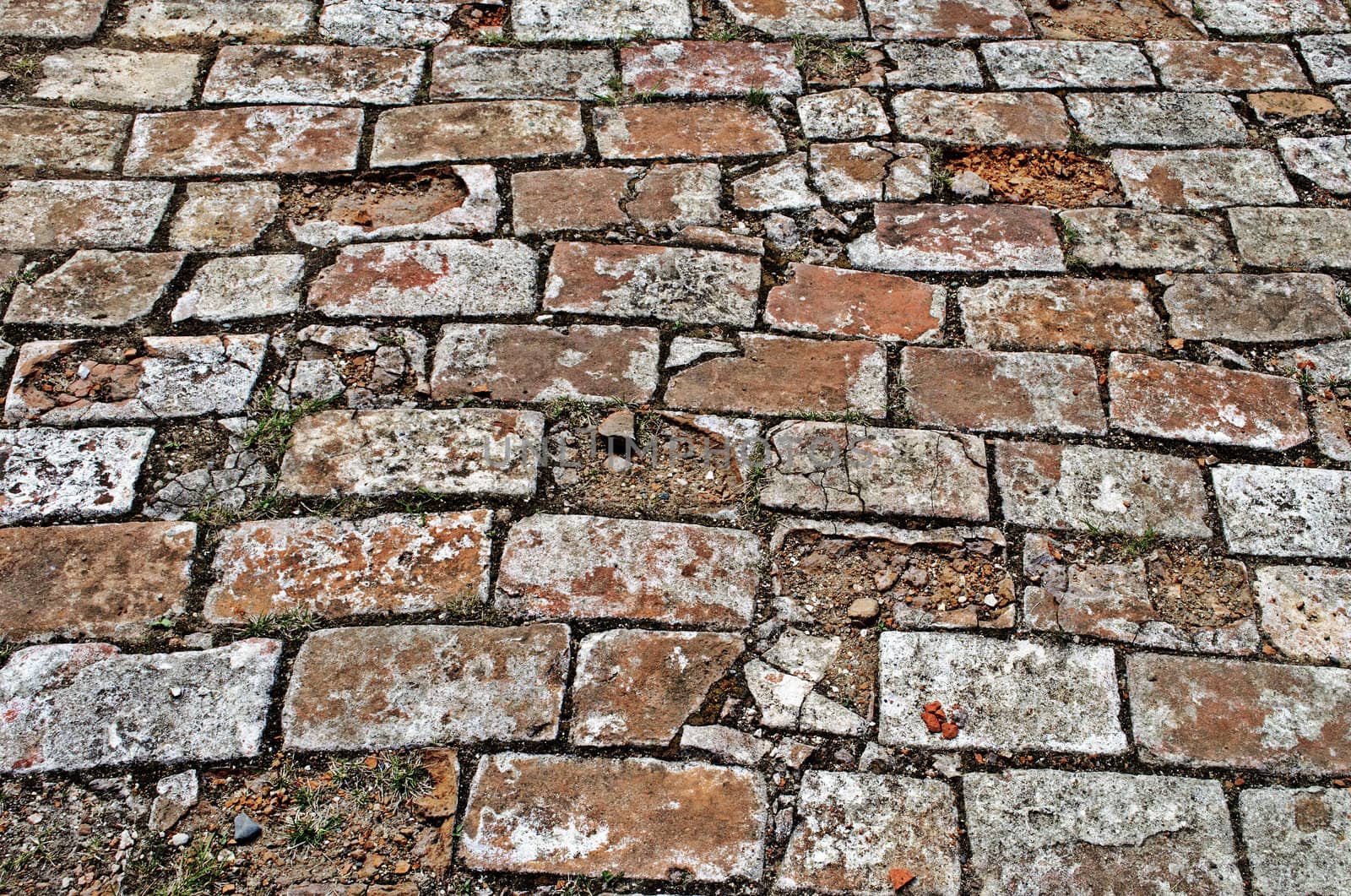 Weathered  brick pavement surface in ancient monastery