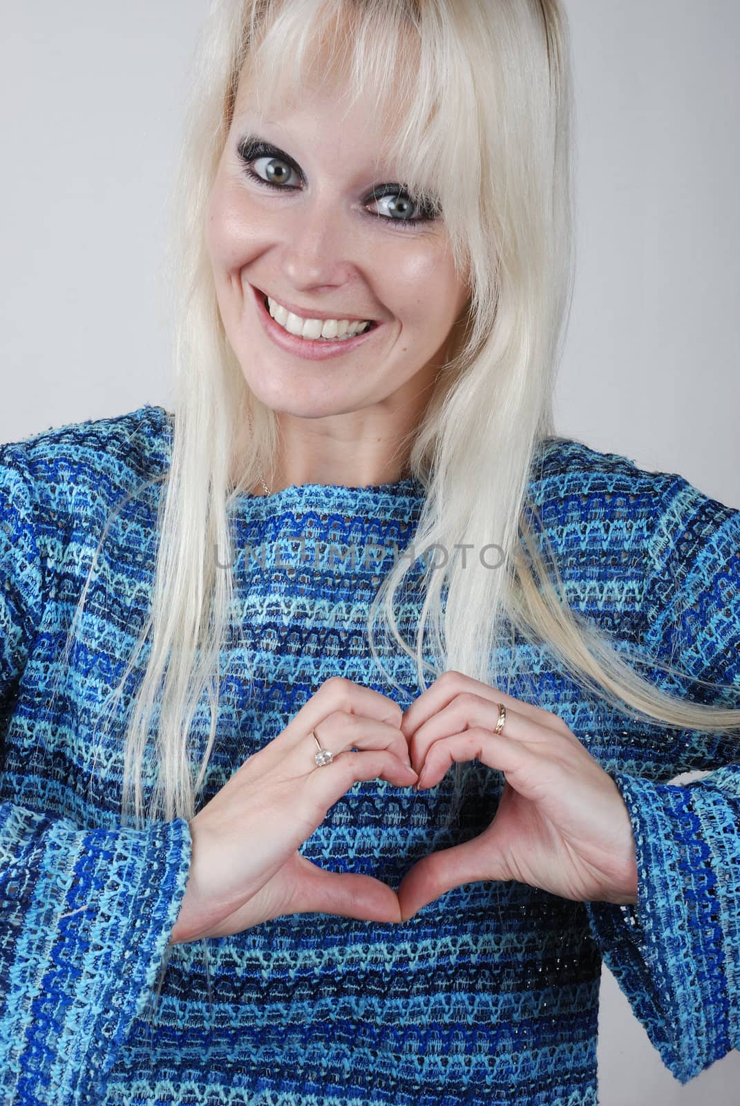 Woman making heart shape with her hands