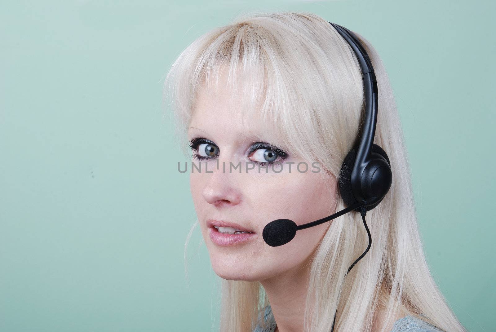 Portrait of young woman with headset