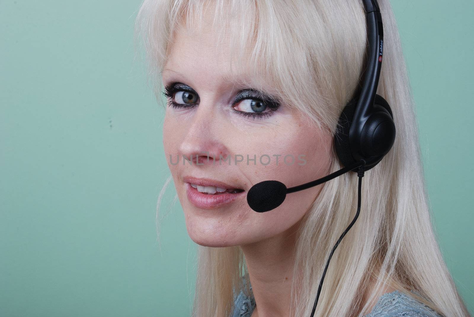 Portrait of young woman with headset