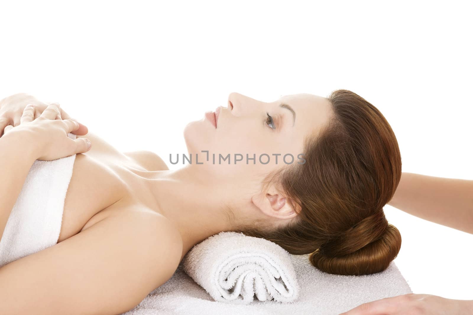 Attractive woman relaxing beeing massaged in spa saloon