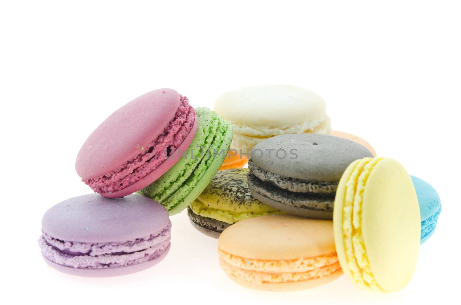 traditional colorful  french macaroons over white background