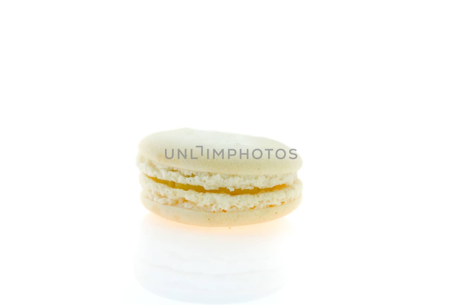 cream  french macaroons over white background , single  dessert