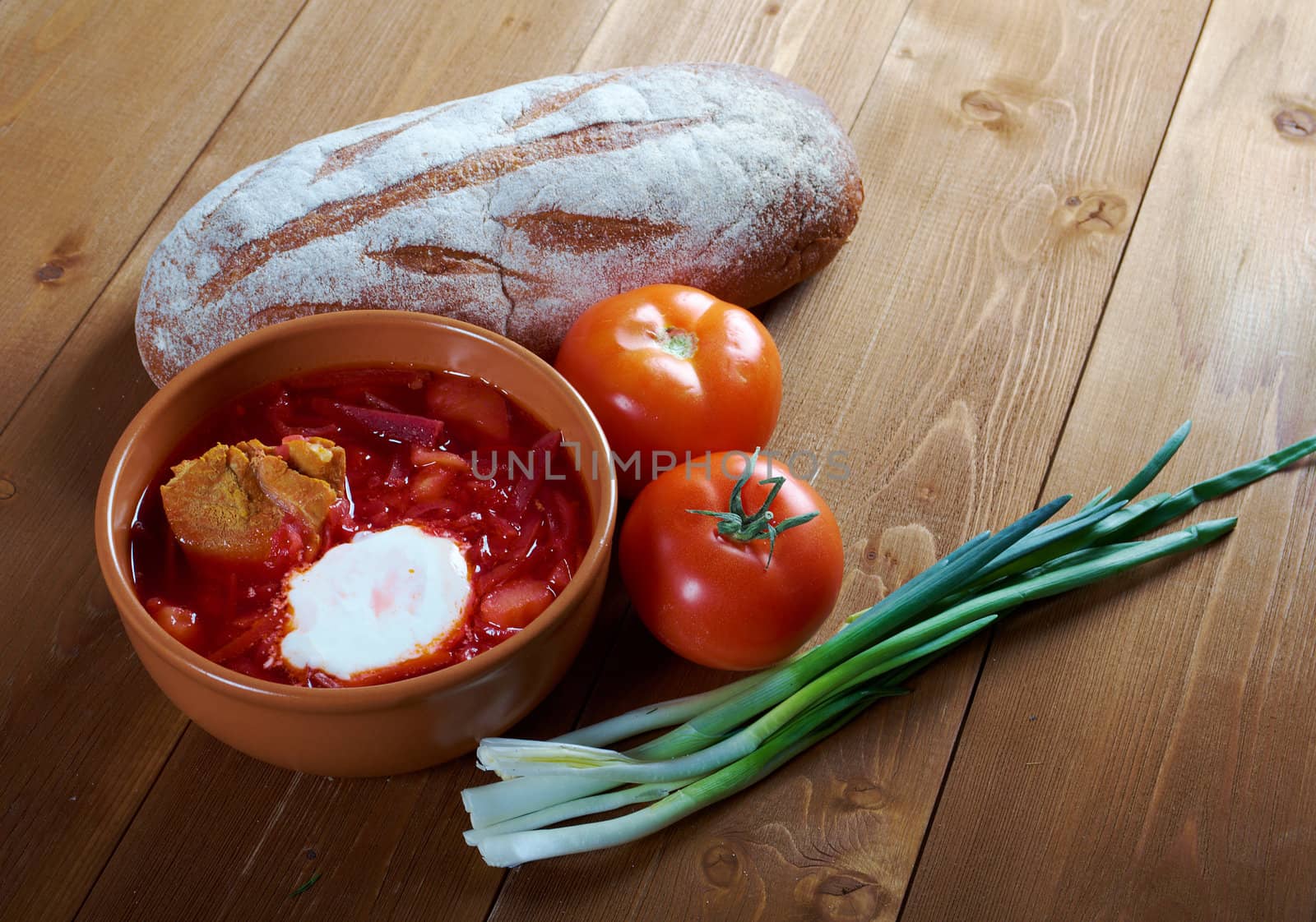 ukrainian and russian red-beet soup (borscht) with garlic and sour cream