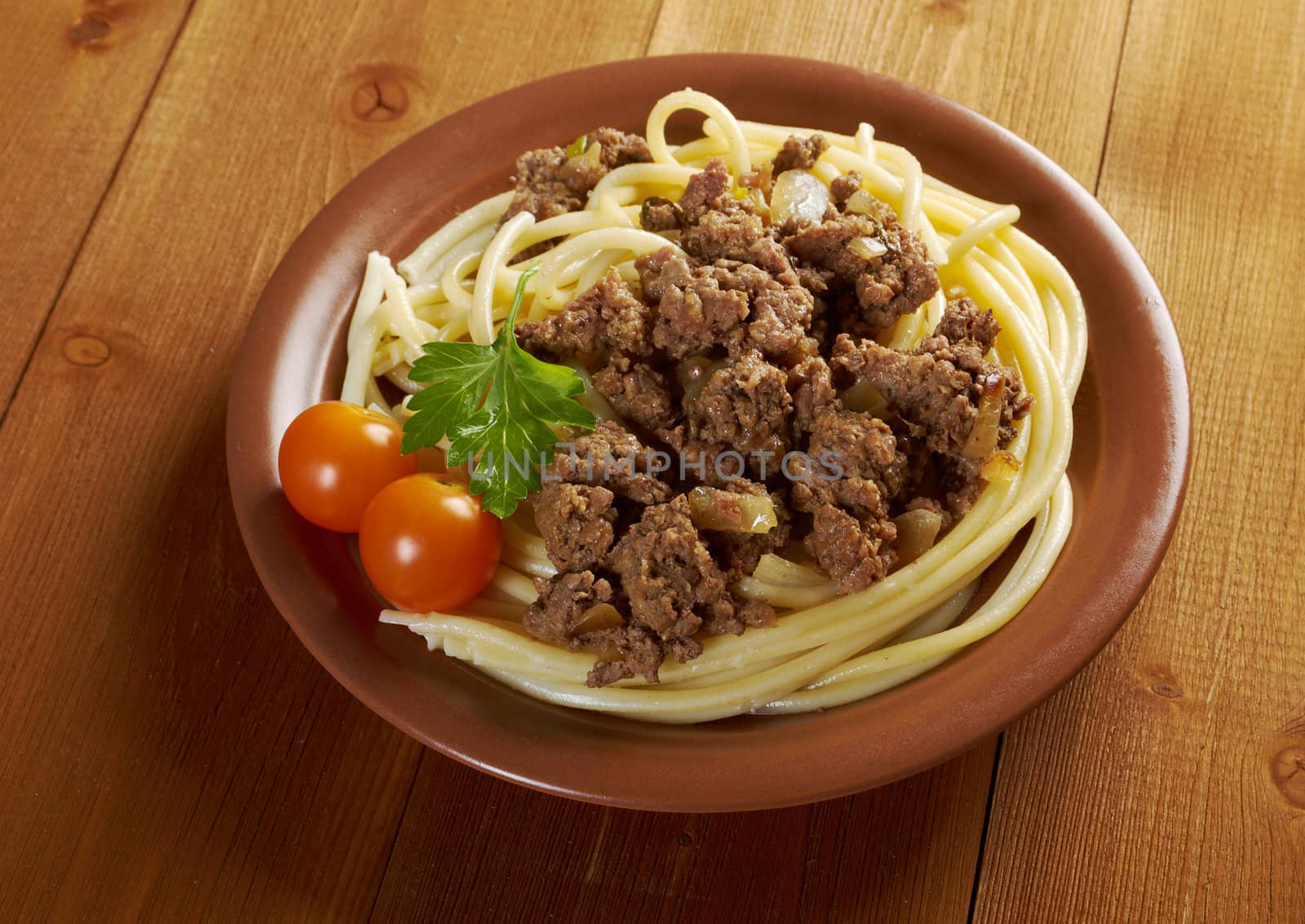  pasta with  beef on wooden table