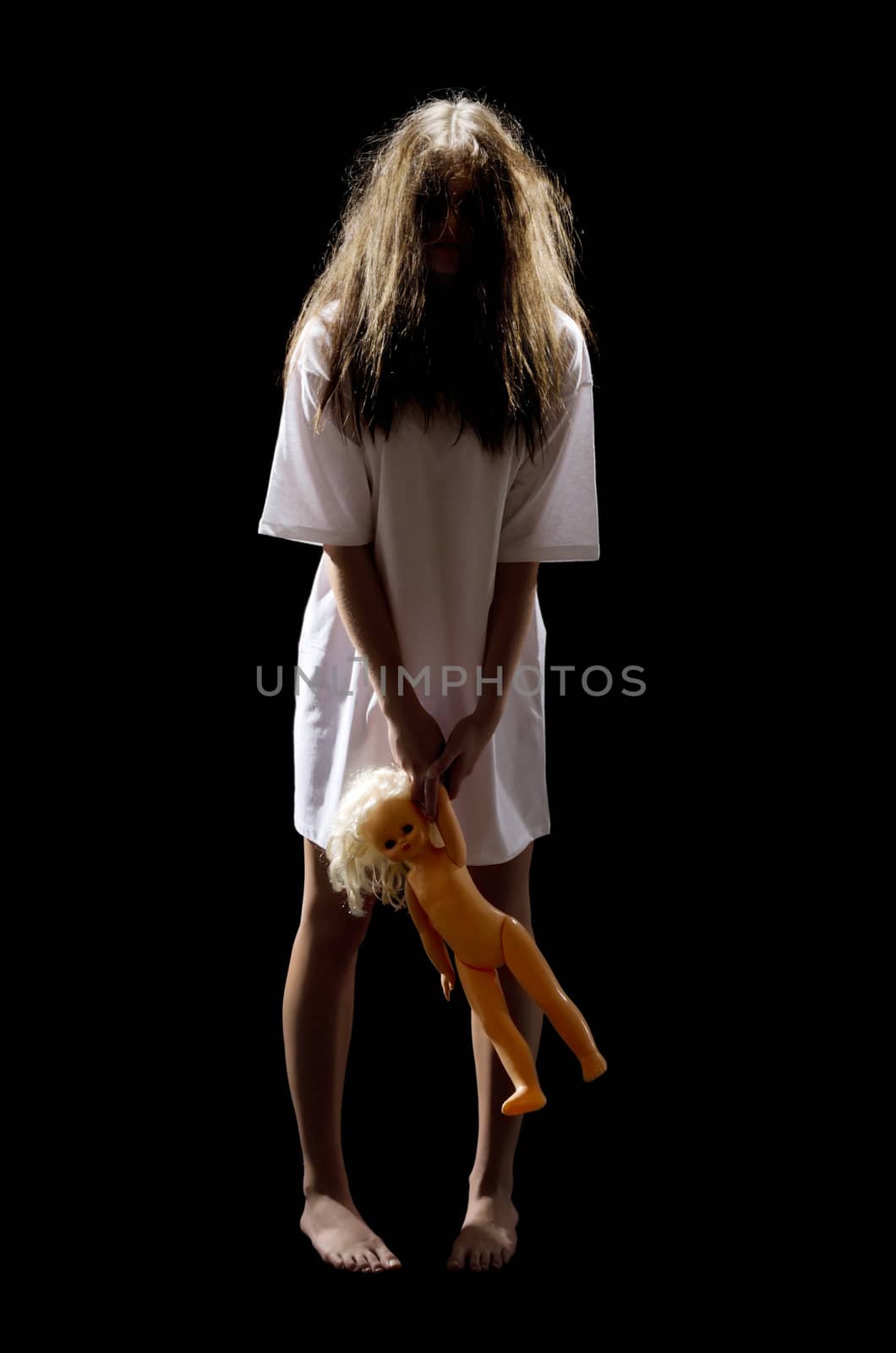 Zombie girl with plastic doll isolated