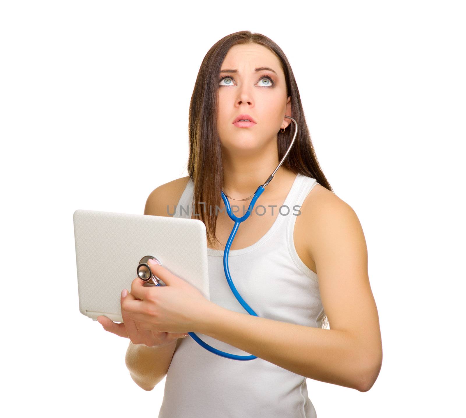 Young girl listening laptop by stethoscope isolated