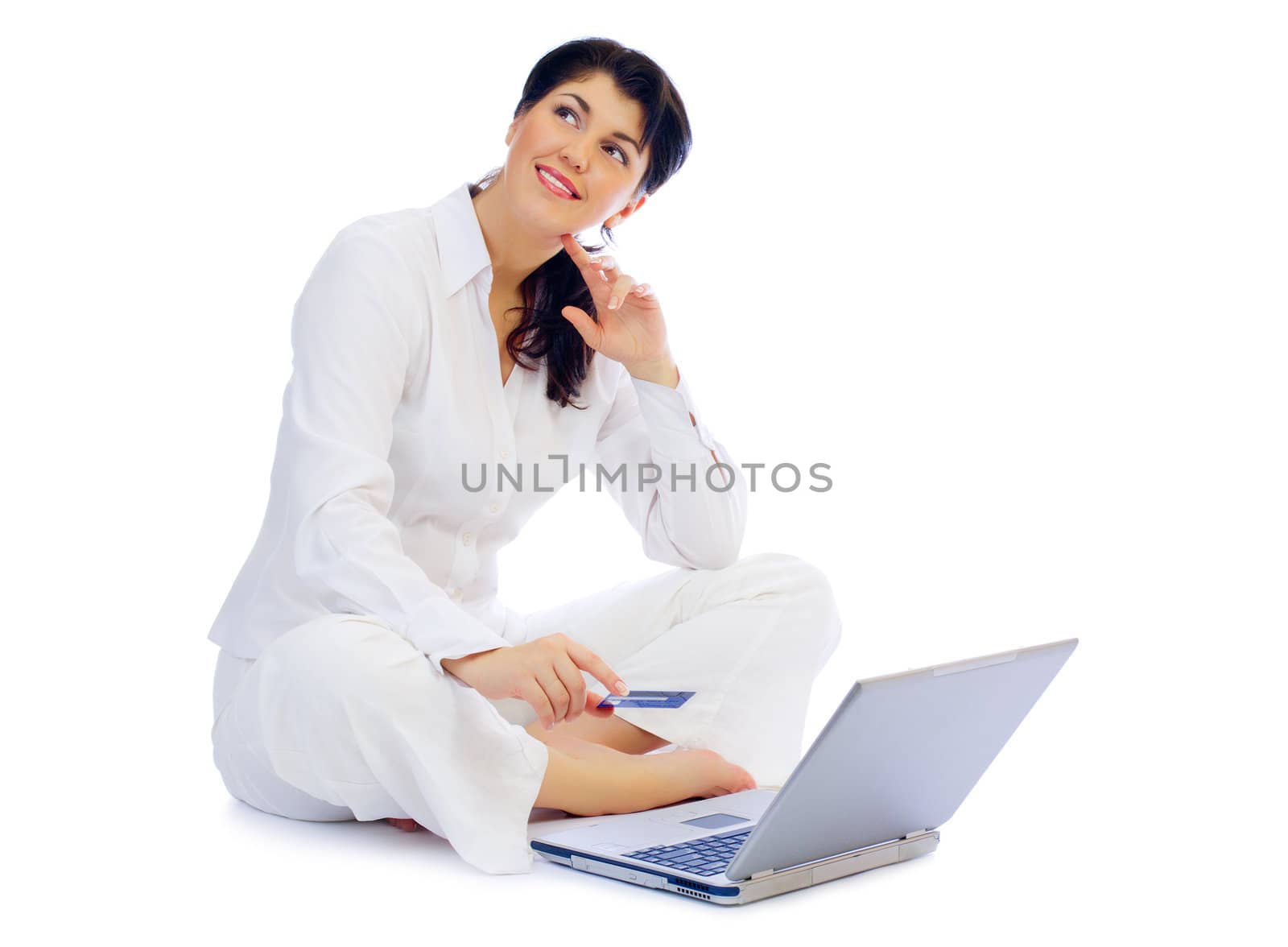 Smiling young woman with credit card and laptop by rbv