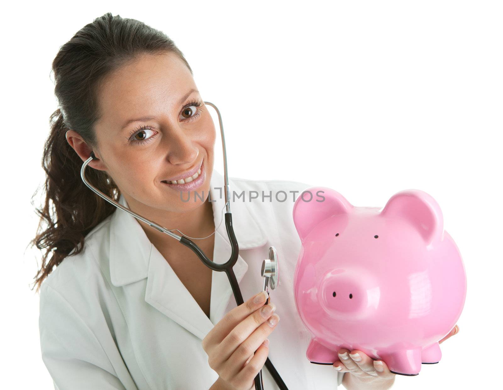 Doctor inspecting piggy bank. Isolated on white