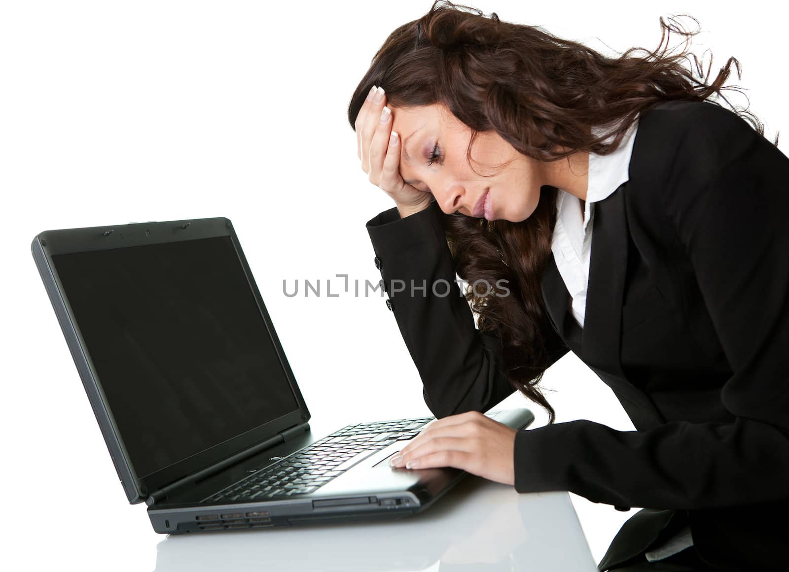Stressful business woman working on laptop. Isolated on white