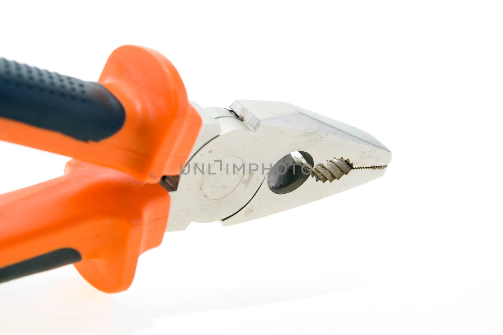 Steel used pliers with plastic color handles on a white background