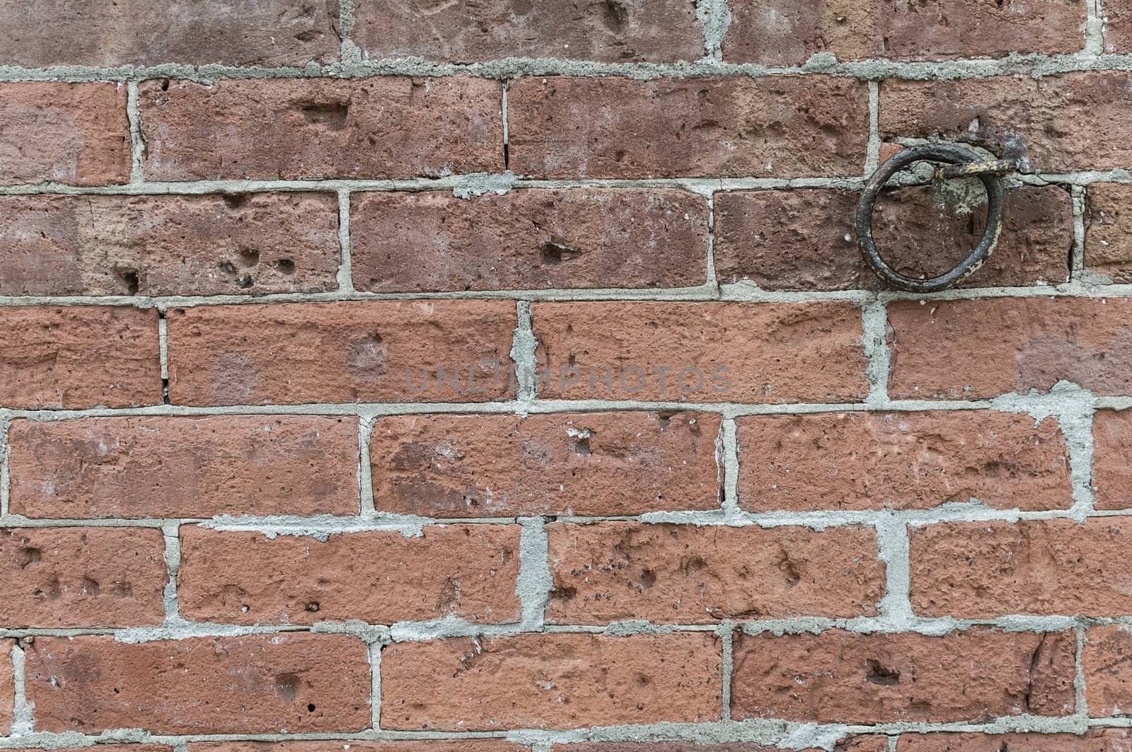 Rough red brick wall with iron link by Shane9