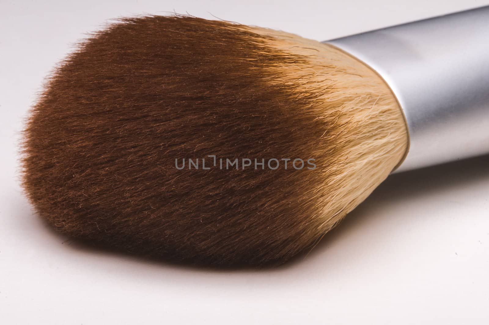 Make-up brush close up on white background.