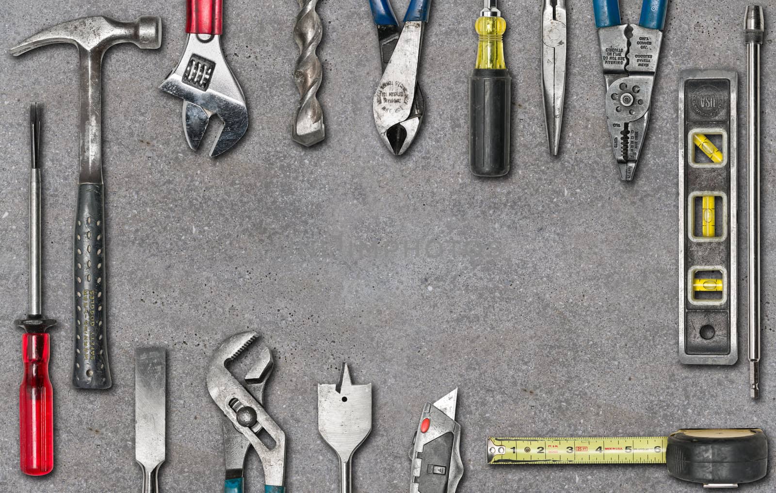 Group of used tools on concrete with space