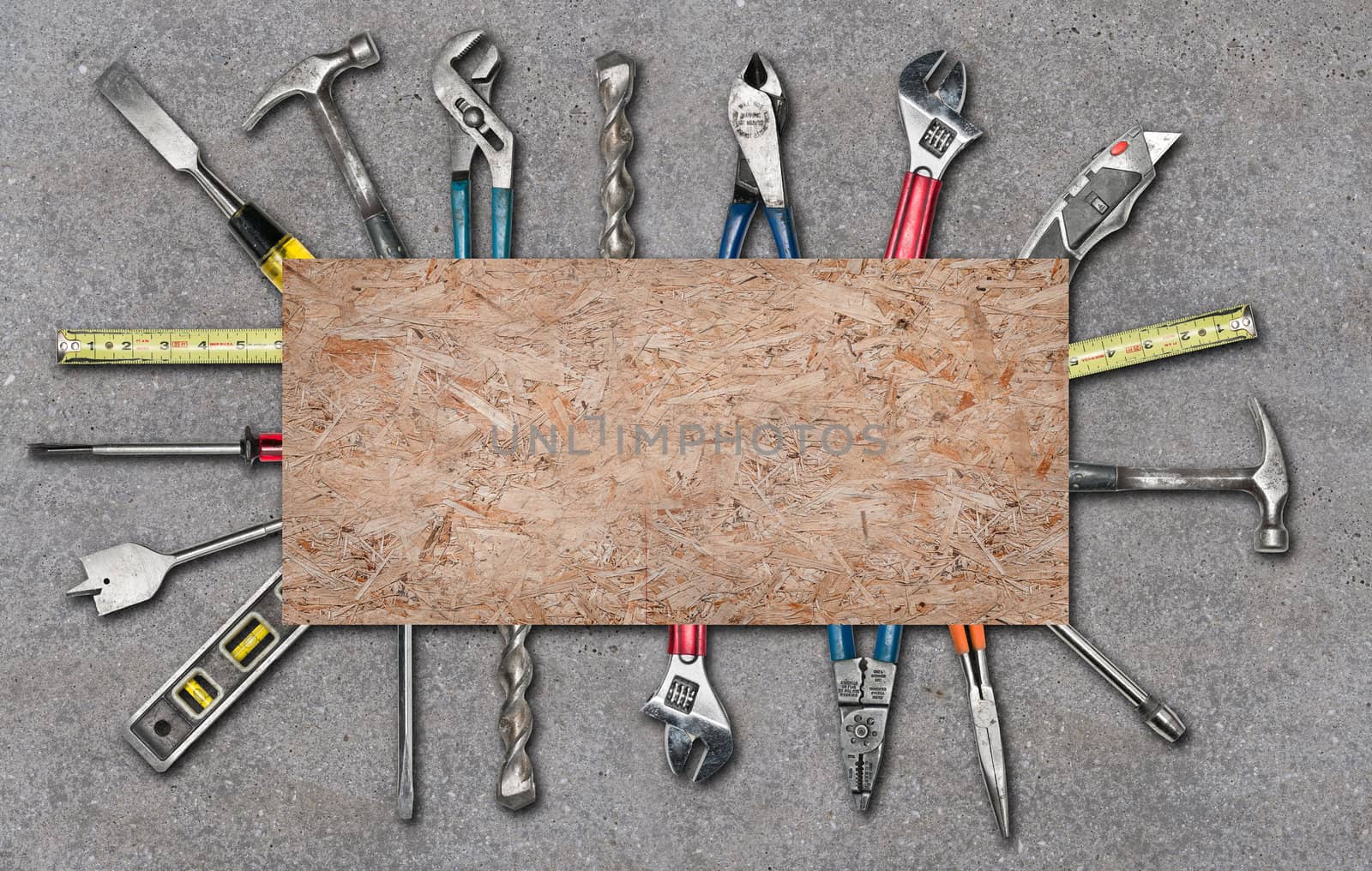 Various used tools on concrete background by Shane9