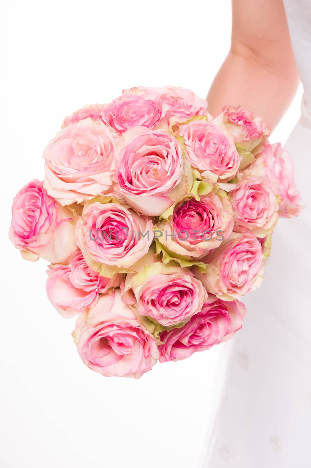 Young caucasian bride holding a bouquet on isolated white background.