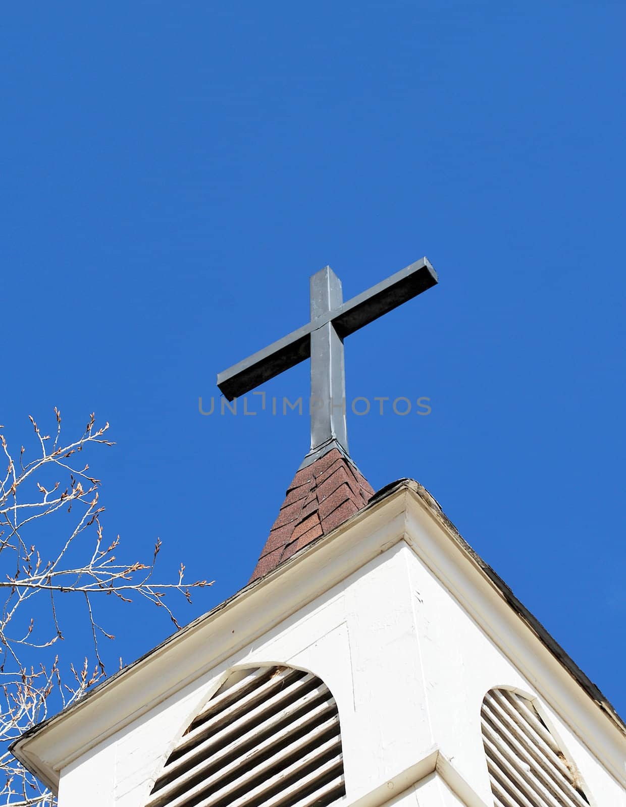 Church steeple against a clear blue sky.