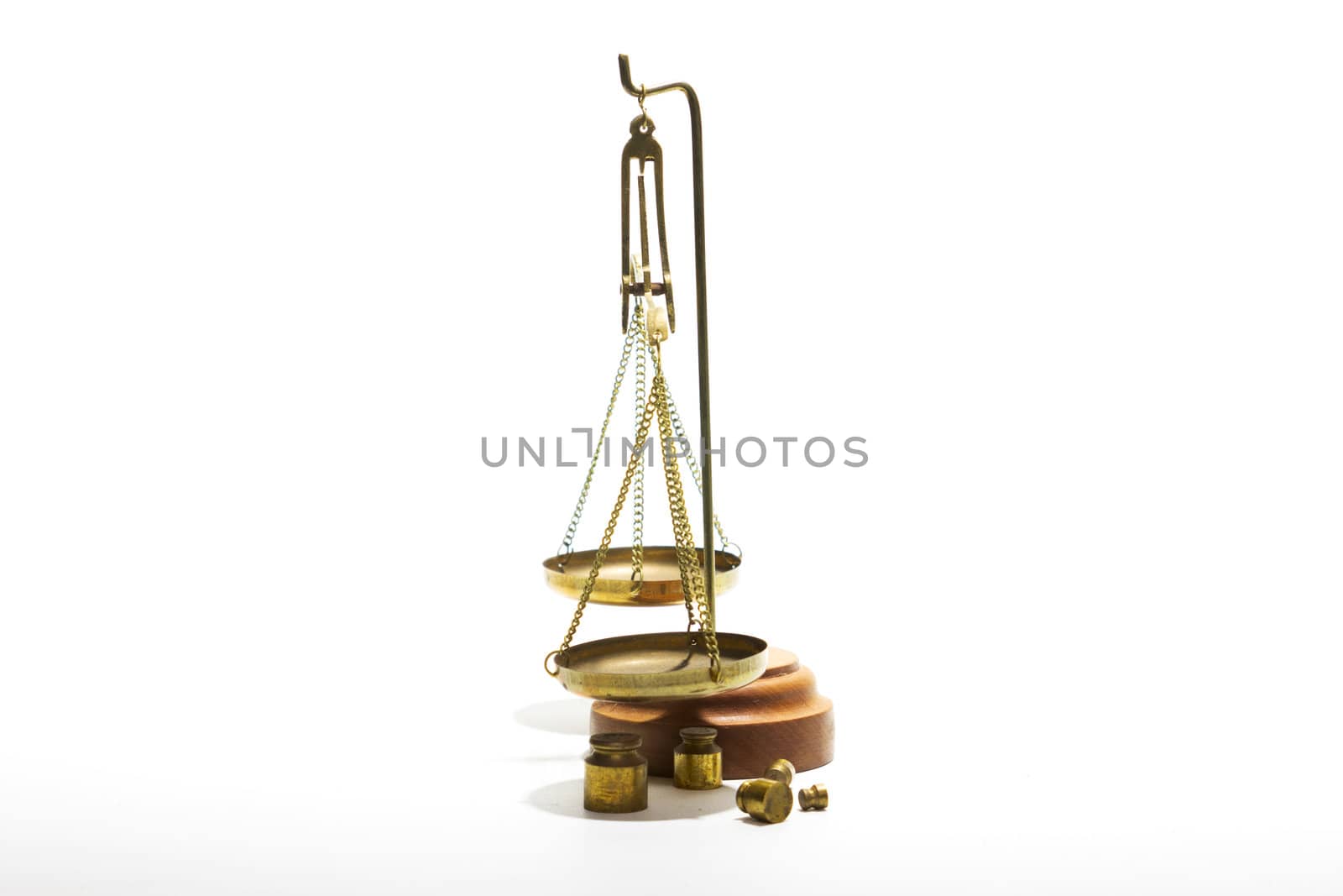 Scales balance and a set of weights on a white background