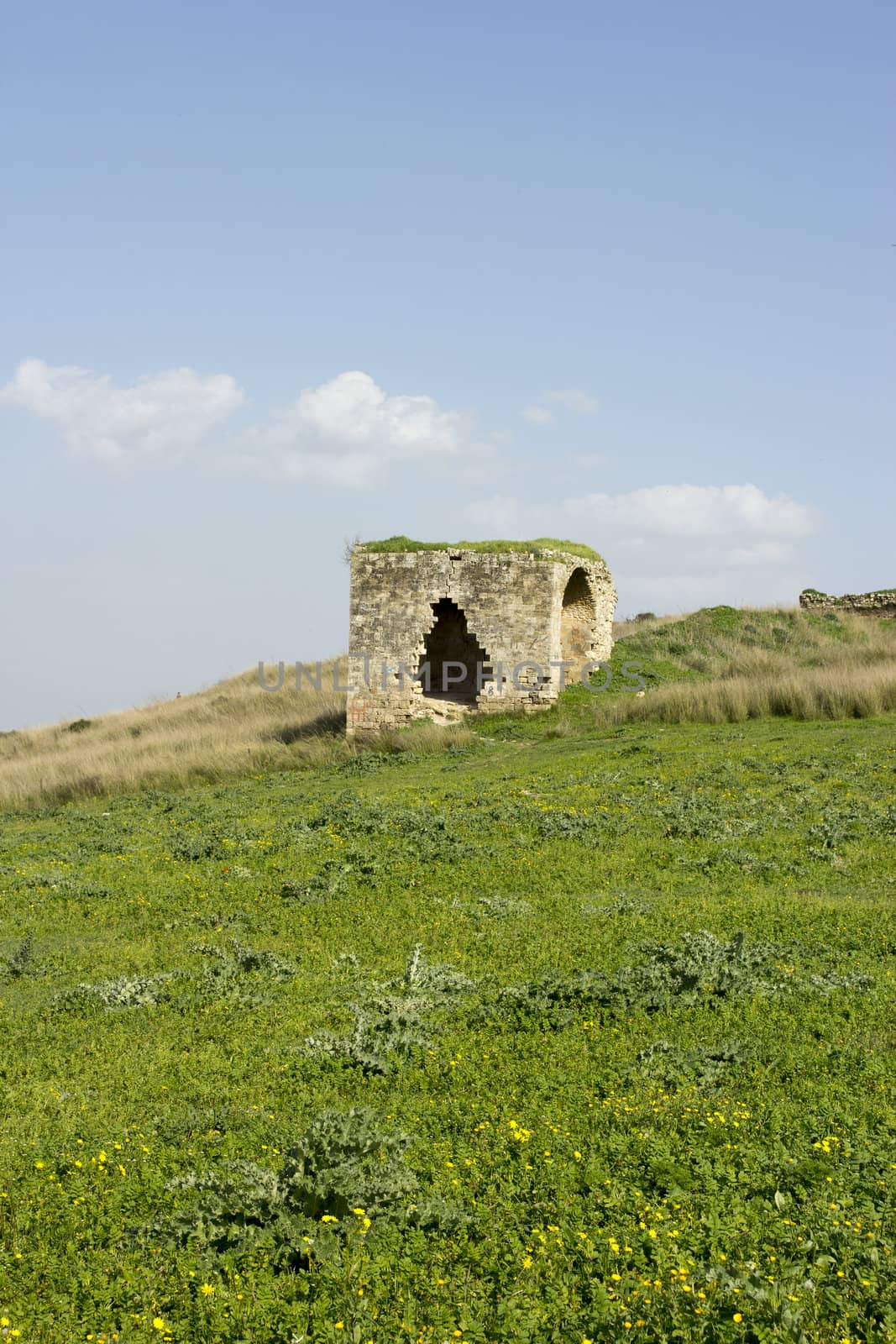 Old abandoned standing alone ruined house