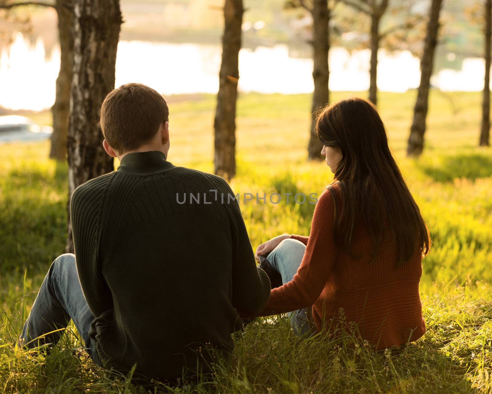 Young couple having fun outdoors in forest