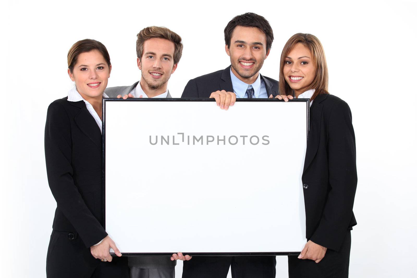 Business team holding blank poster by phovoir