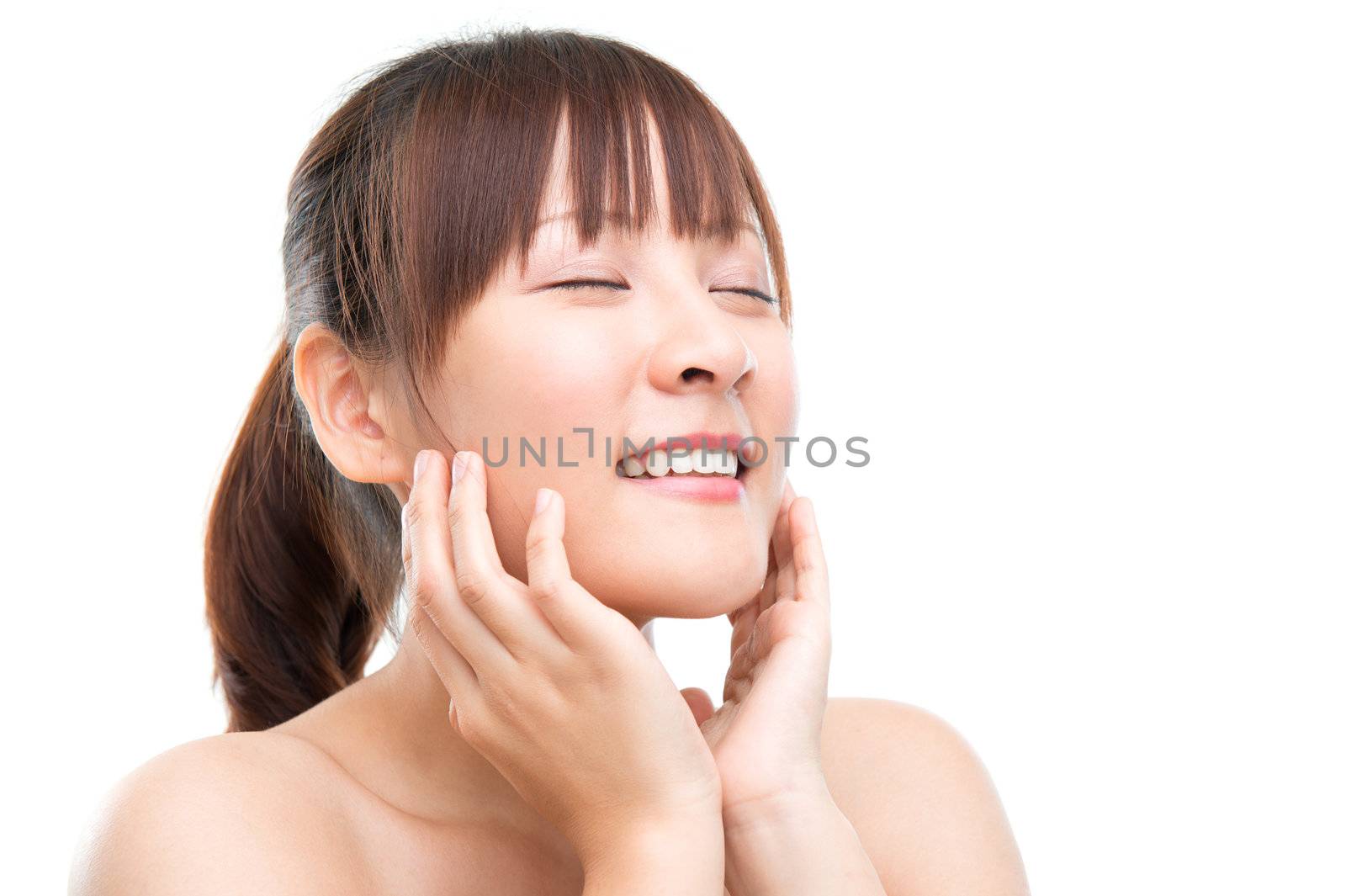 Asian girl skincare concept. Skin refreshing. Close up beautiful young woman face isolated on white.