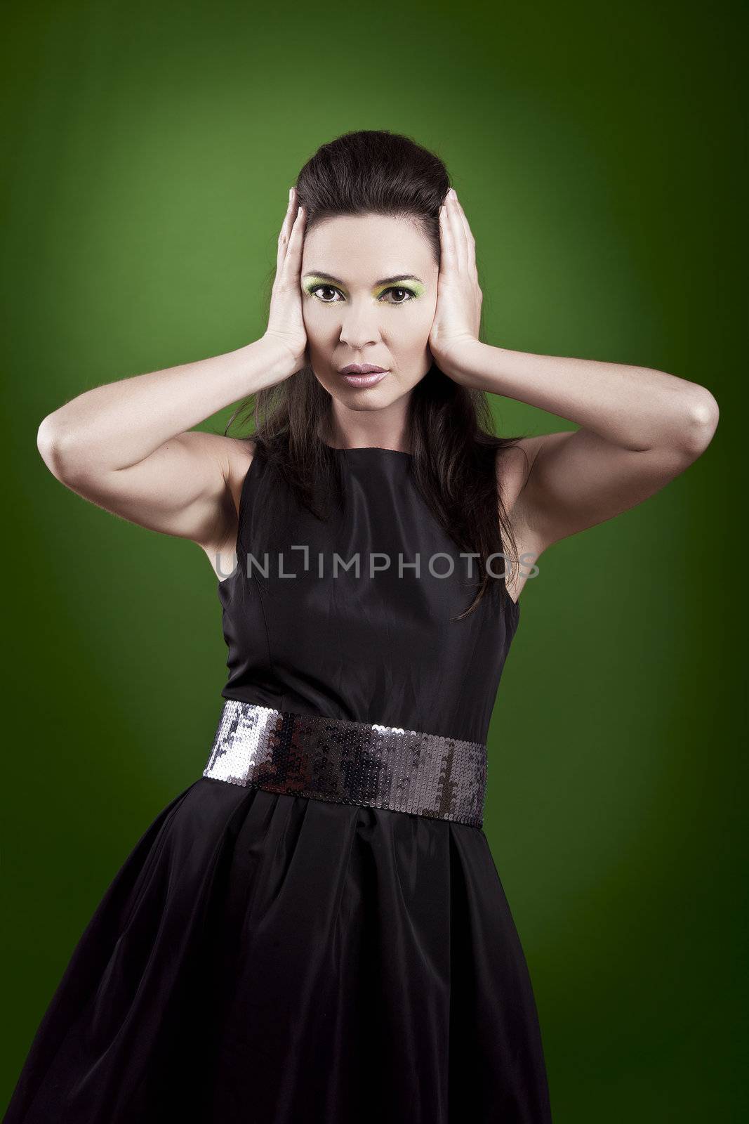 fashion woman posing over a green background