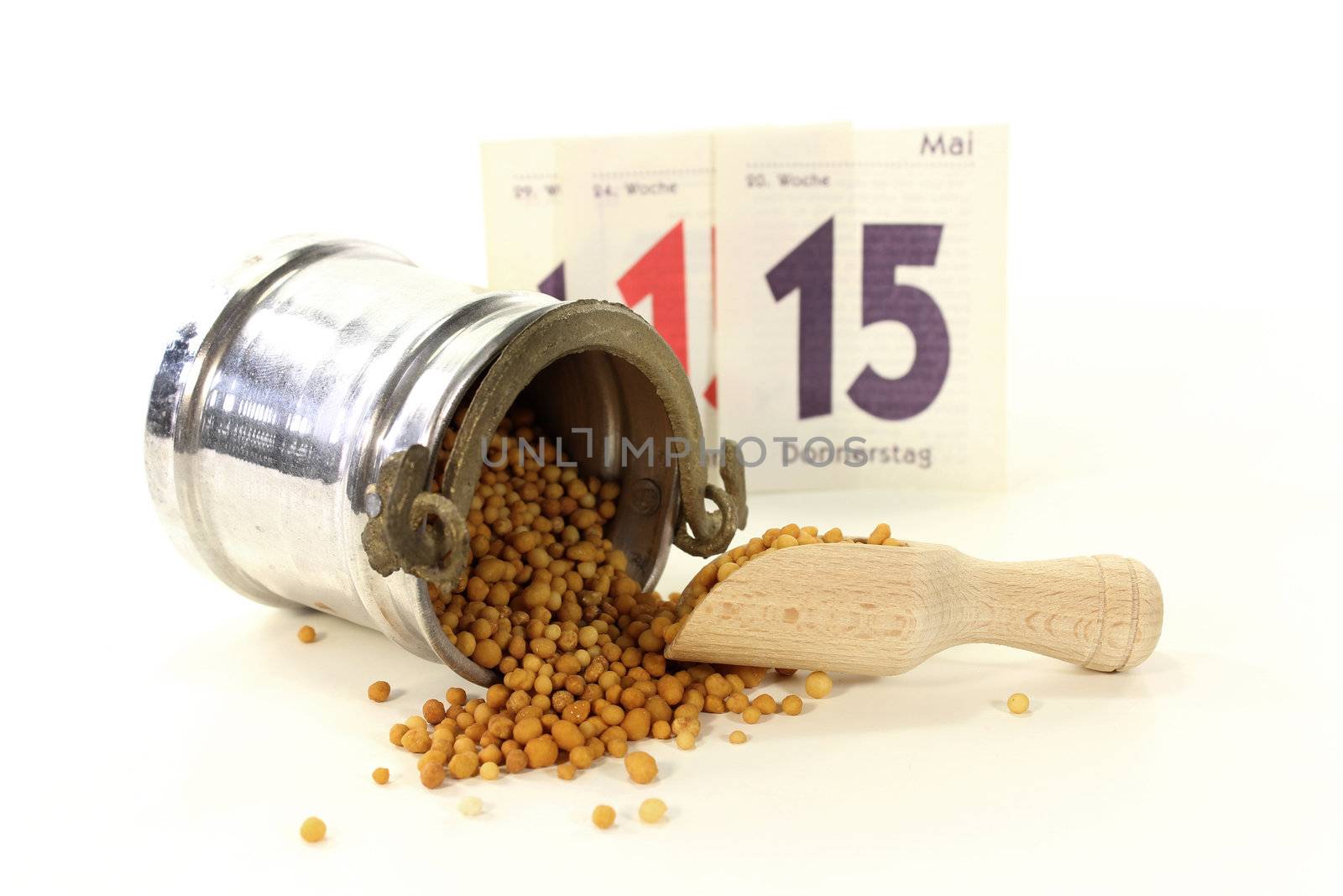 a bucket of slow release fertilizer in front of white background