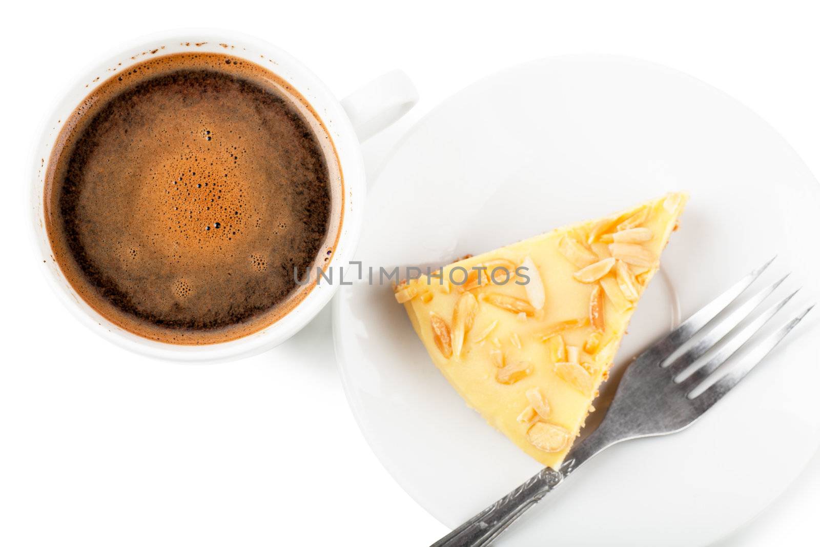Top view of cup of coffee and pie on a white plate