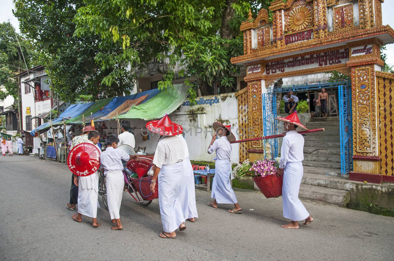 buddhist ceremony in yangon myanmar street