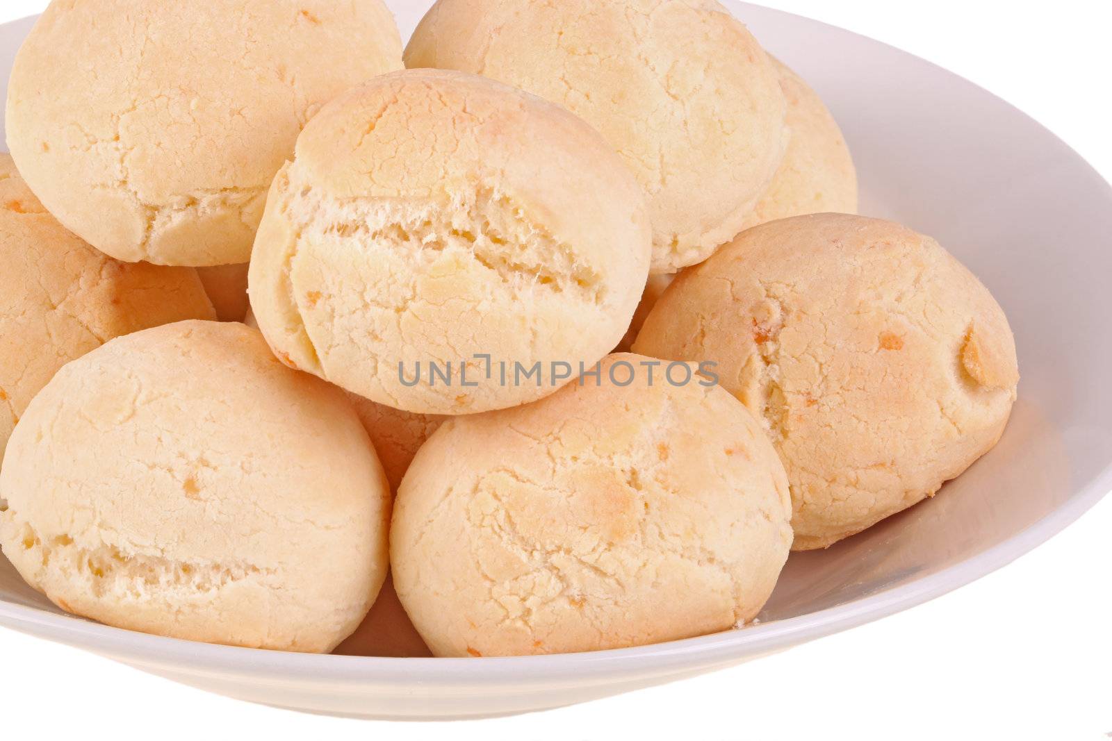 Closeup of several rolls of pan de yuca, the cheese bread made of tapioca (or yuca) flour that is very popular in Ecuador, also known as pandebono in Colombia or pao de queijo in Brazil