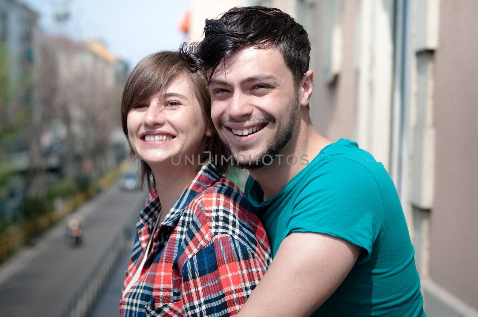 couple embracing on balcony