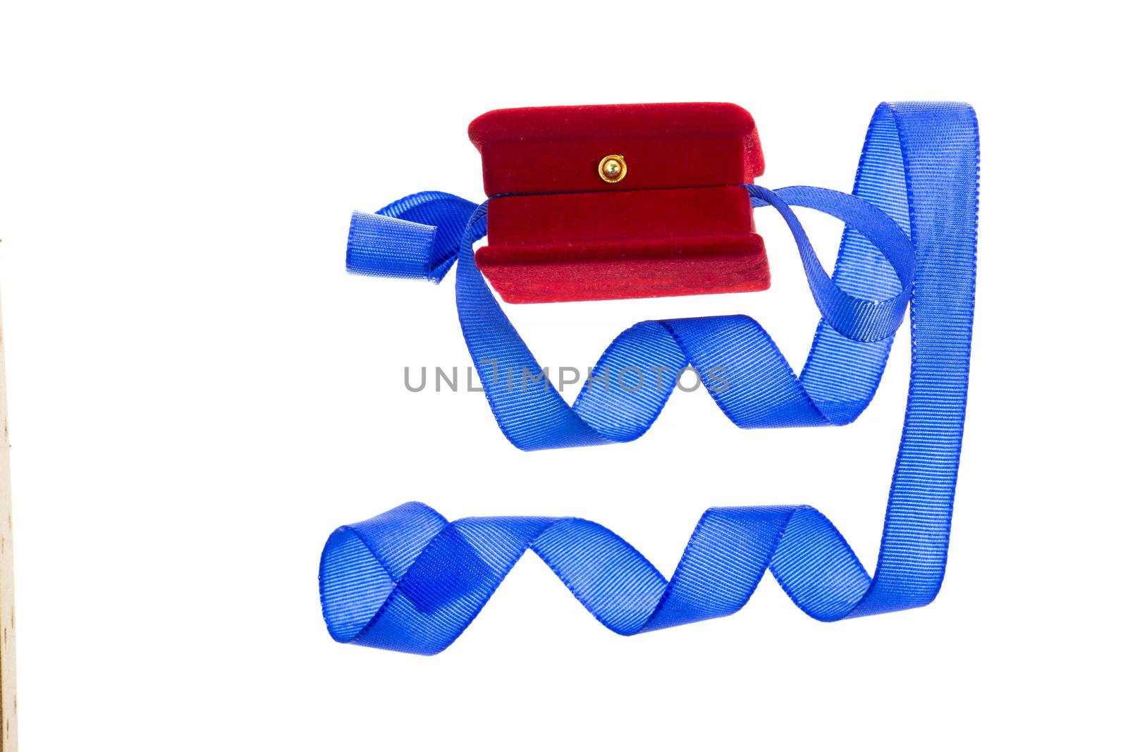 Red velvet gift box and blue ribbon on a white background