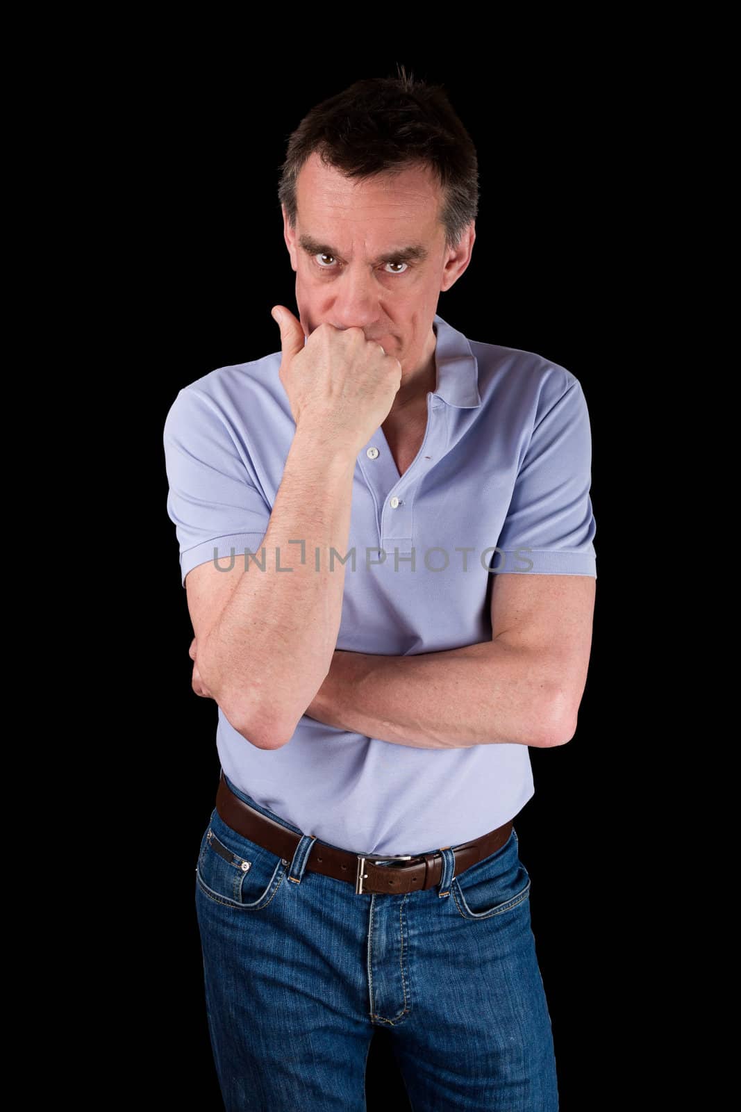 Angry Frowning Middle Age Man Glaring over Hand on Chin Black Background