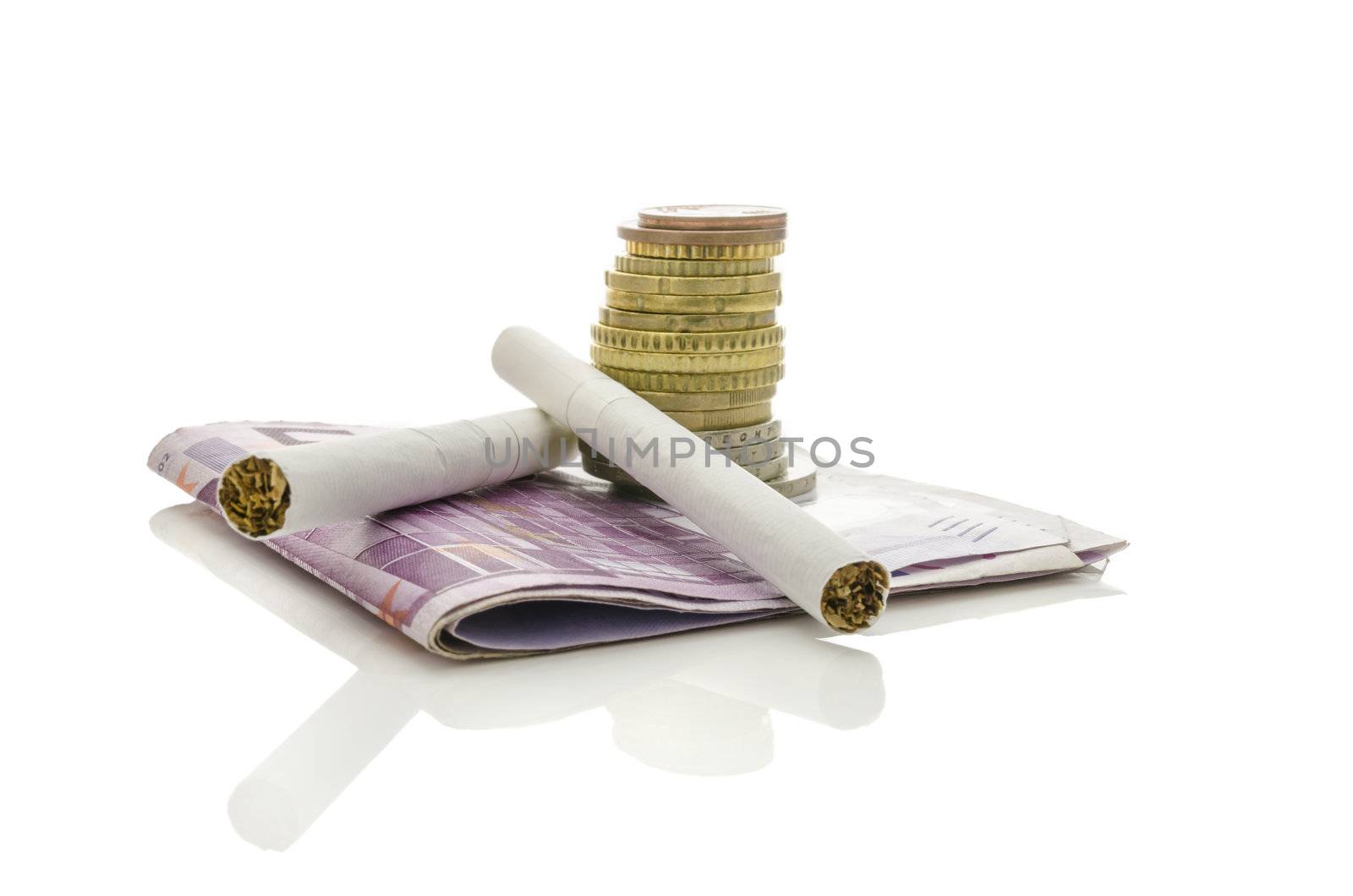 Two cigarettes with stack of Euro coins and banknotes. Isolated over white background. Concept of expensive smoking habit.