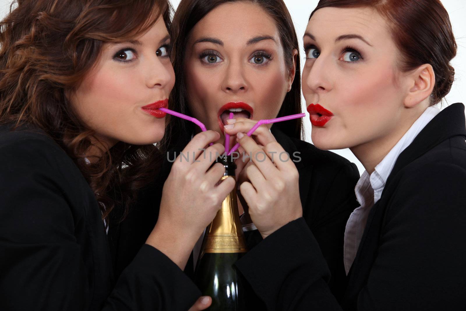 Women drinking champagne by phovoir