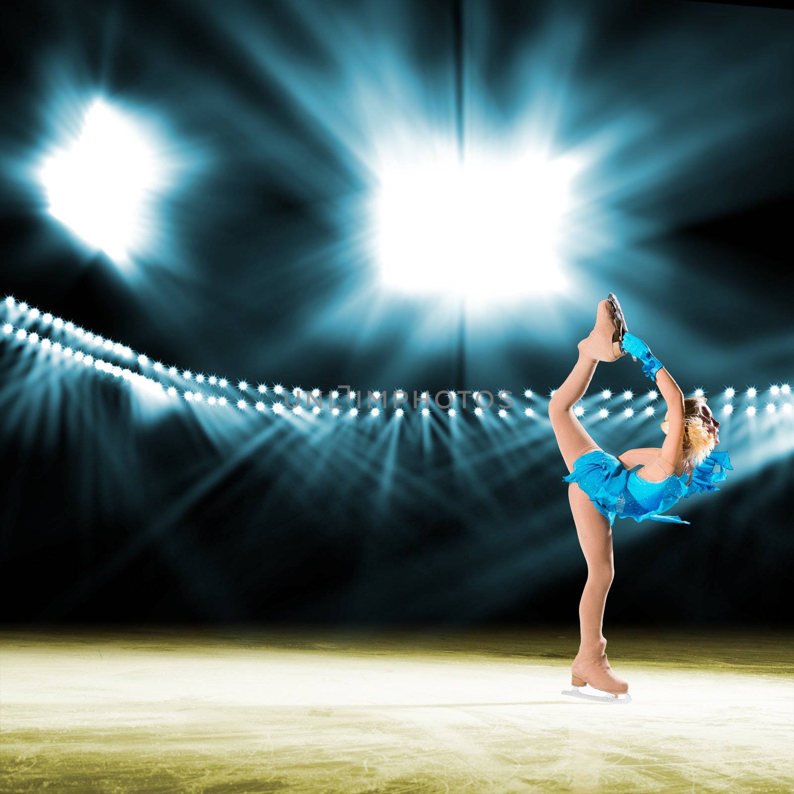 young skater performs on the ice in the background lights lighting