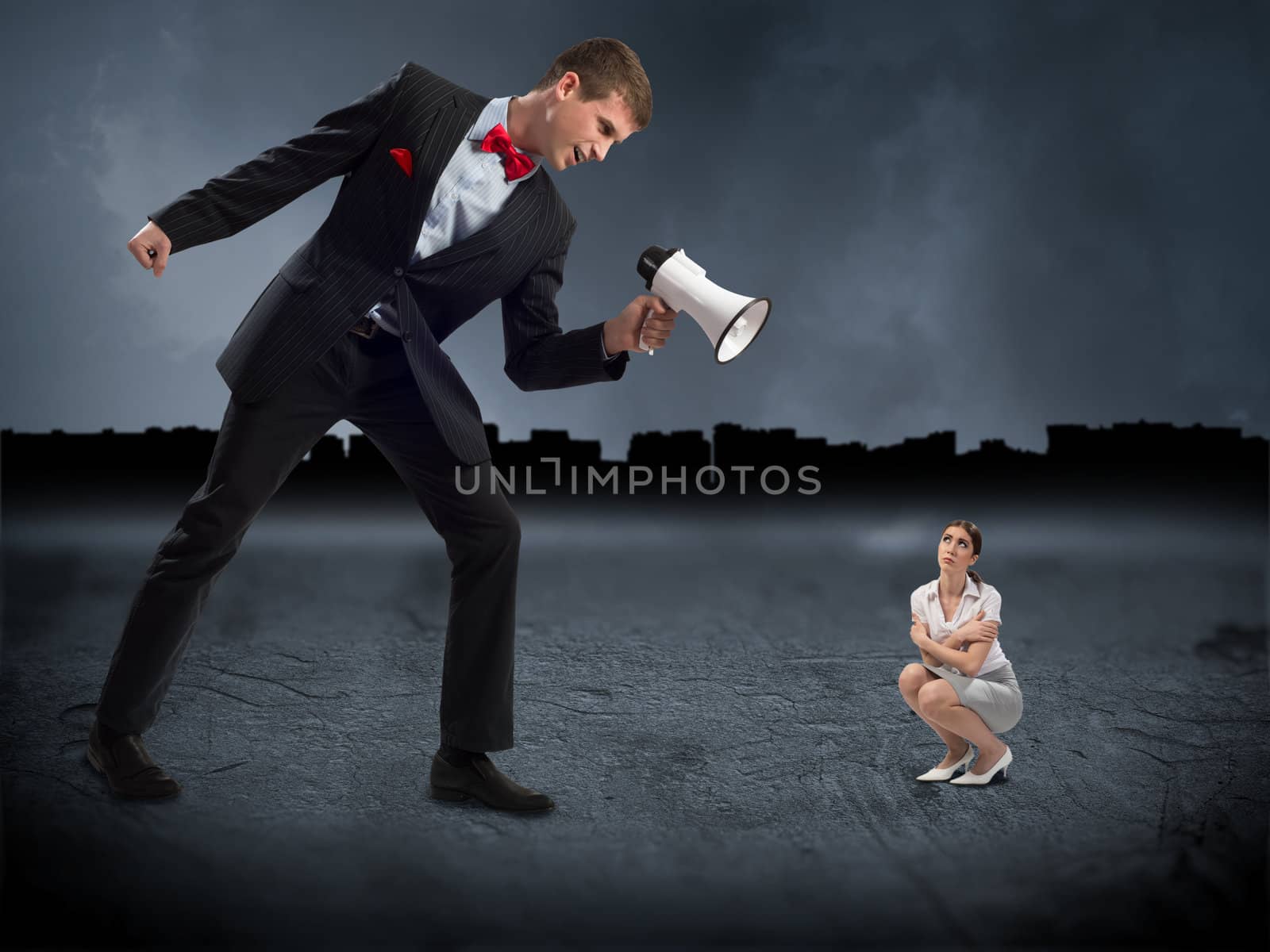 man screams at the frightened woman, the concept of aggression