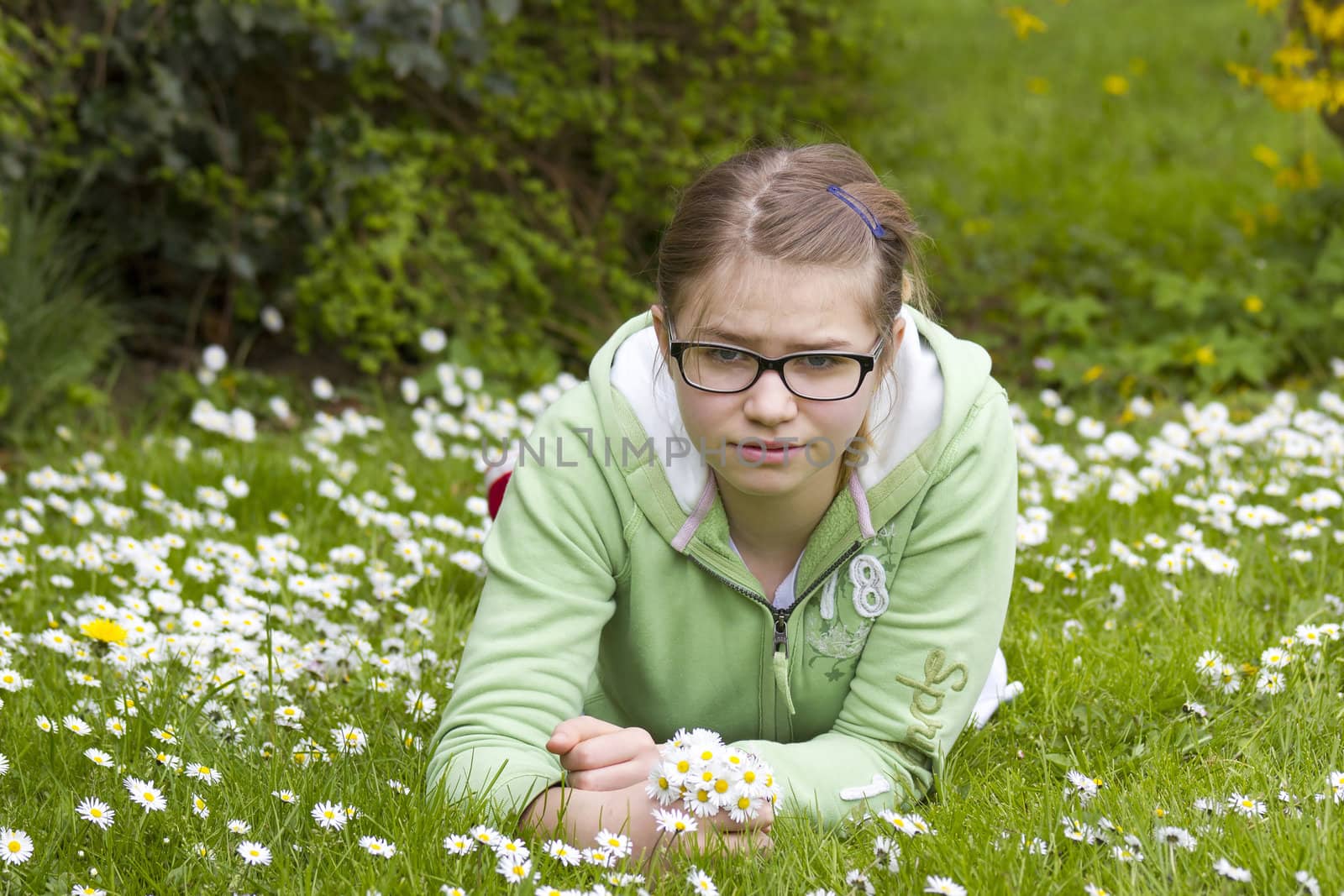 young girl picking daisies by miradrozdowski