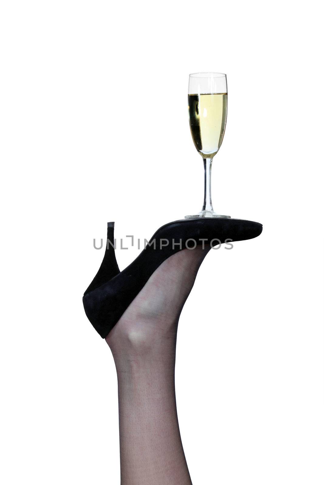 flute of champagne posed on sole of pump by phovoir